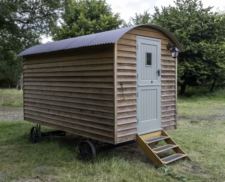 closeup-shot-small-wooden-house-wheels