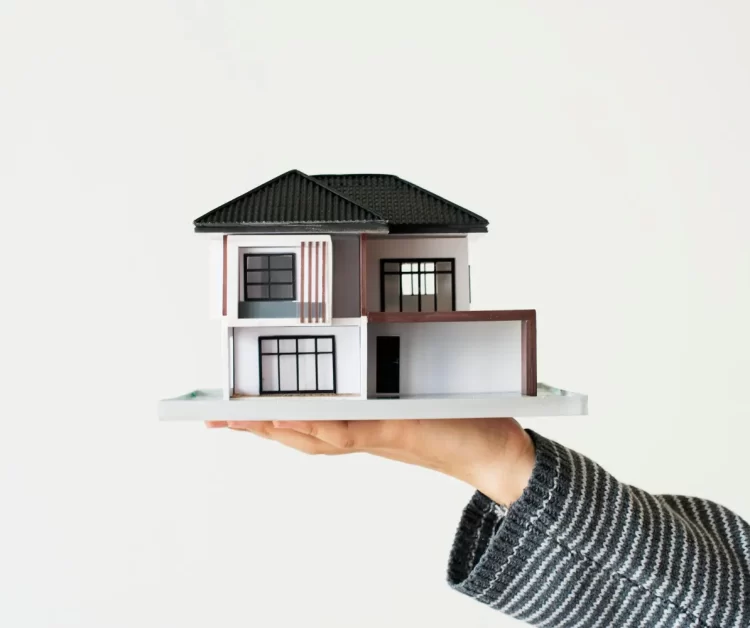 hand-presenting-model-house-home-loan-campaign